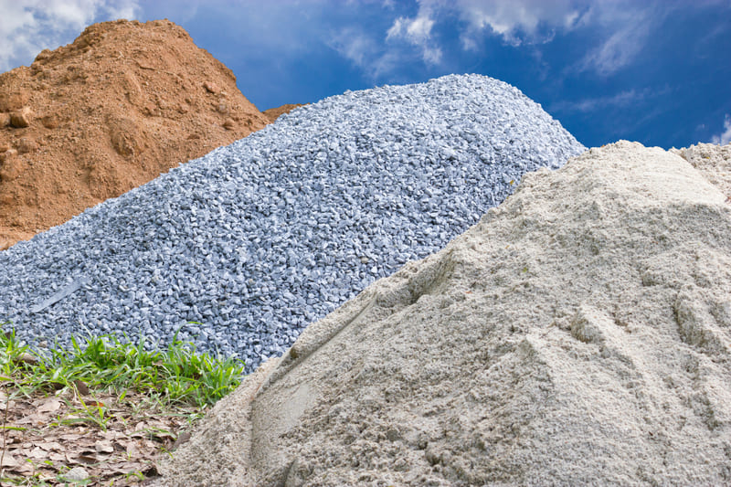 Large Piles Of Sand And Gravel At Supply Yard