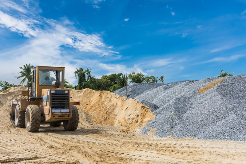Loader Moving Sand And Gravel At Supply Site